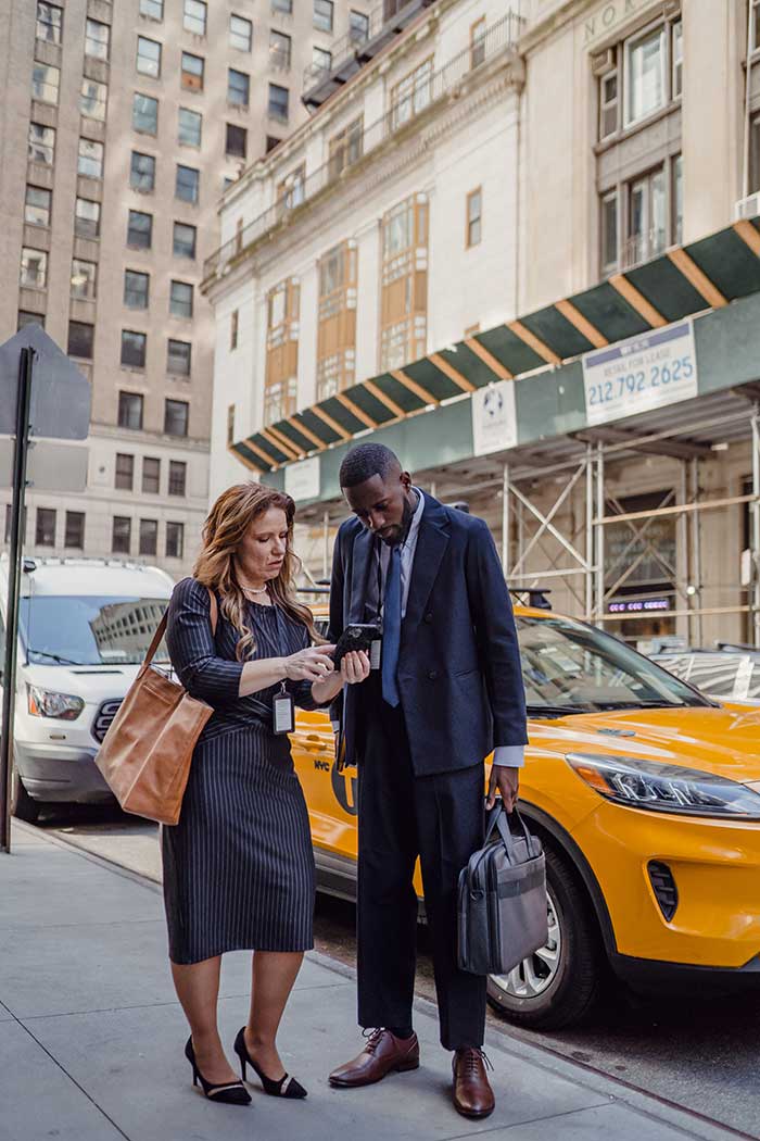 two-people-looking-at-a-phone