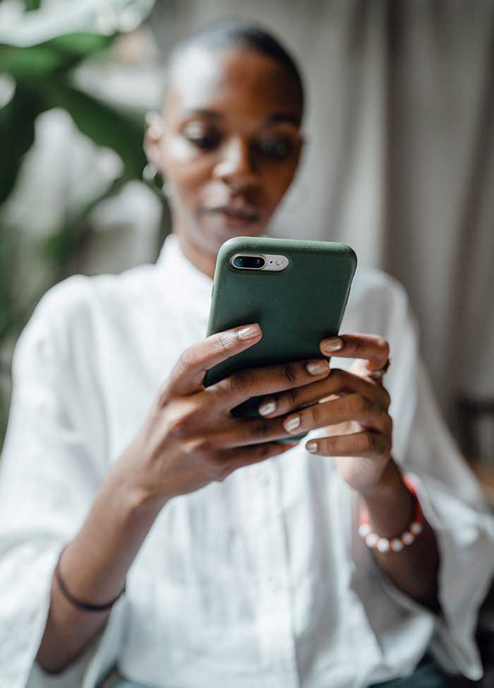 black-woman-messaging-on-modern-cellphone