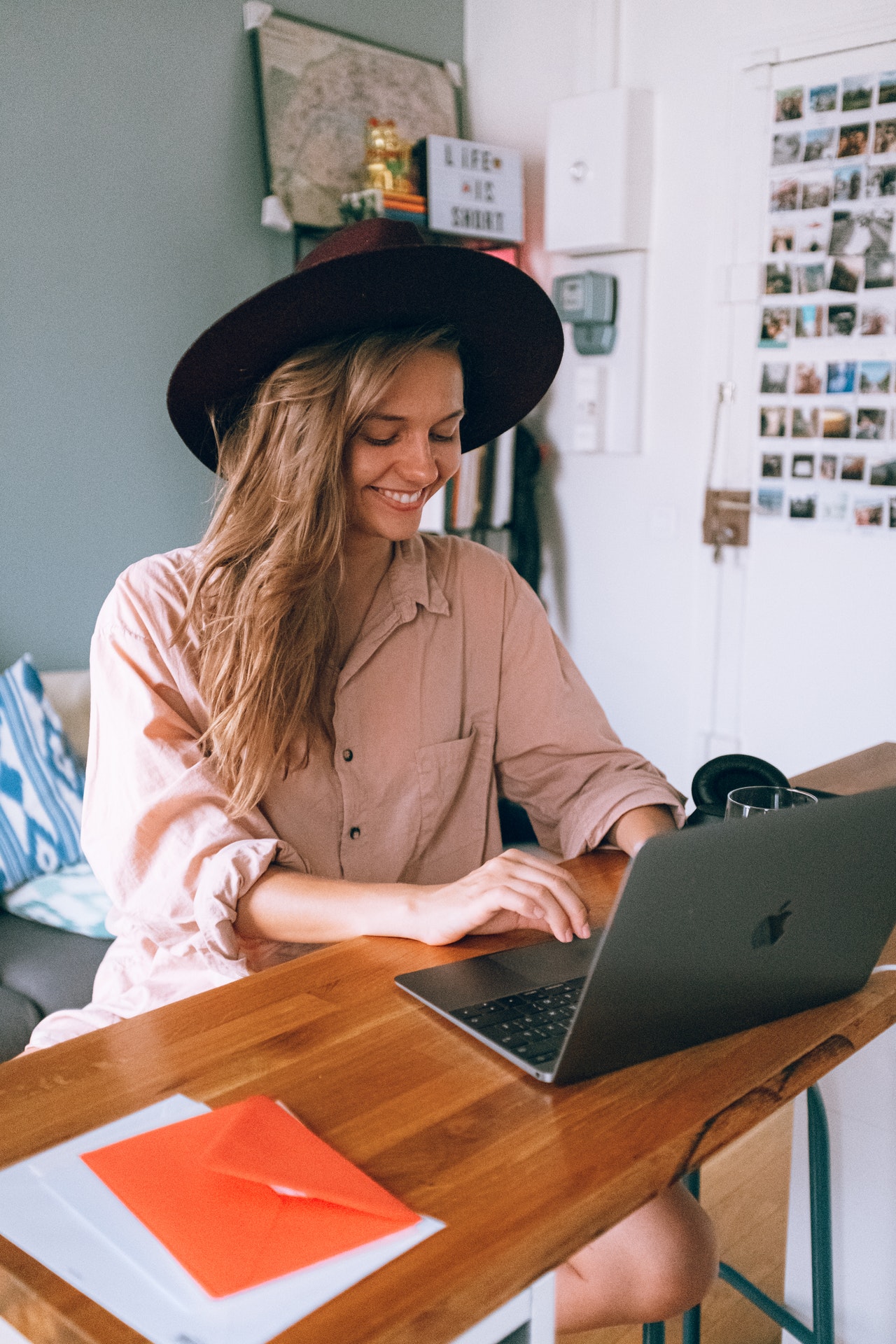 Smiling woman using laptop