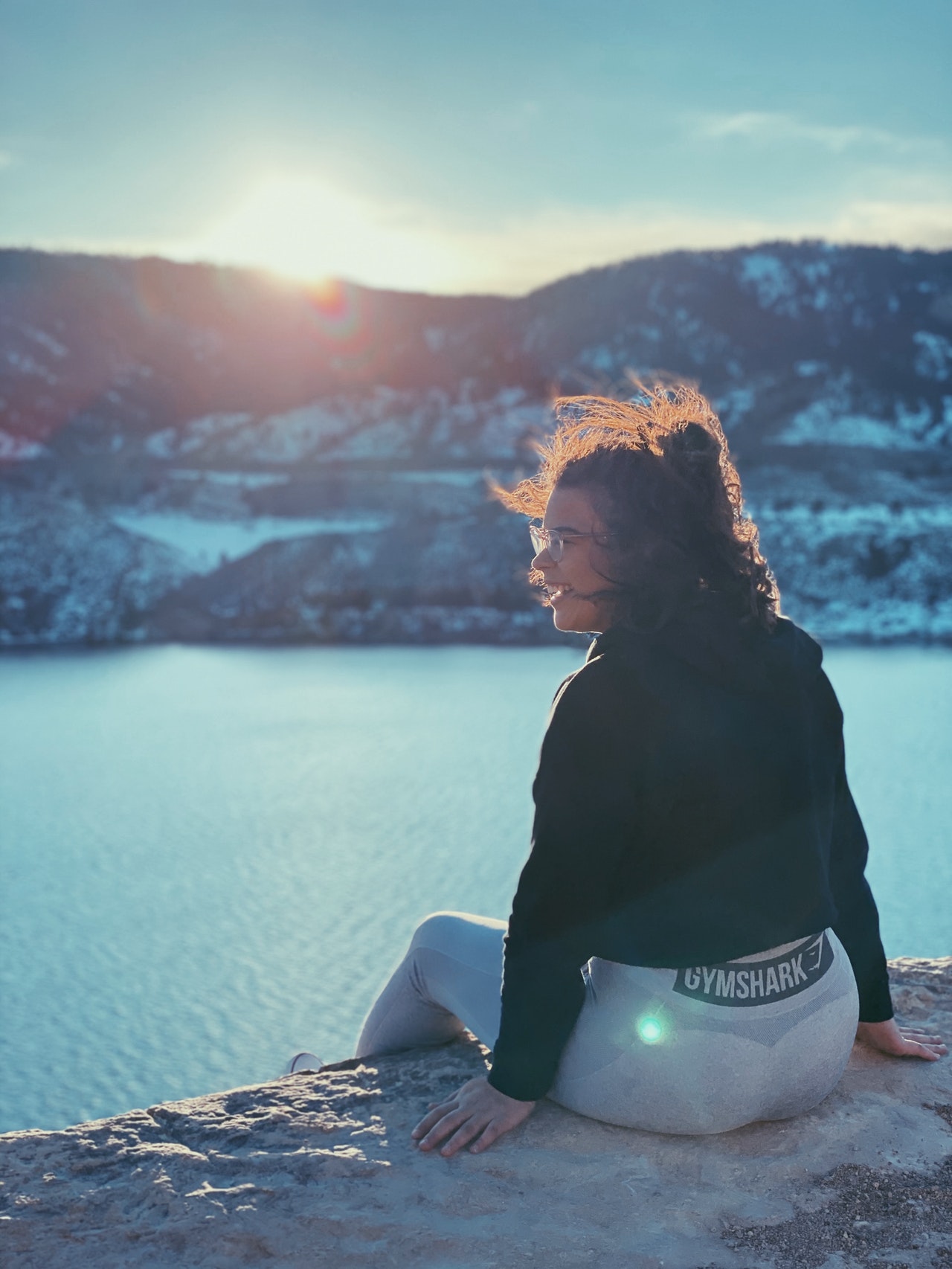 Woman sitting in sunlight